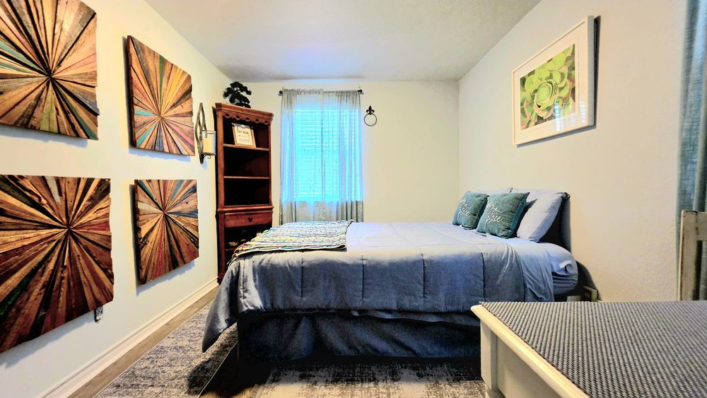 Private suite with handmade wood wall art and a reading nook