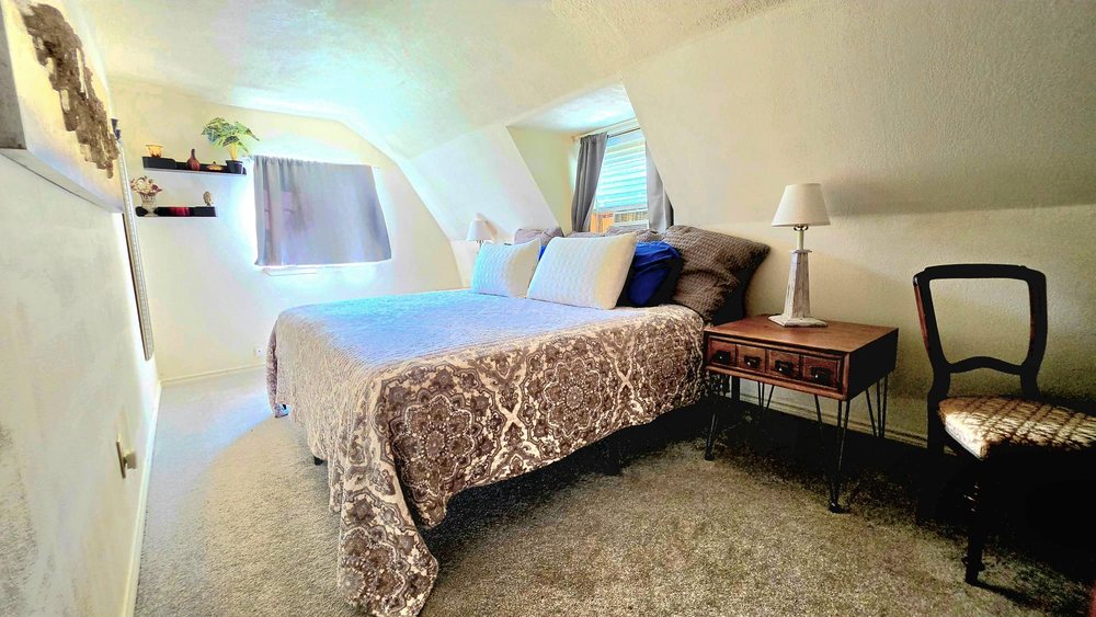 Private suite with eclectic vintage furniture and plants
